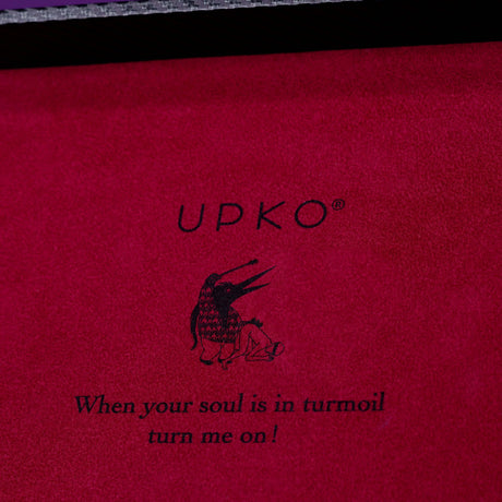 UPKO luxury bondage case interior with artistic penguin design and quote "When your soul is in turmoil, turn me on!"