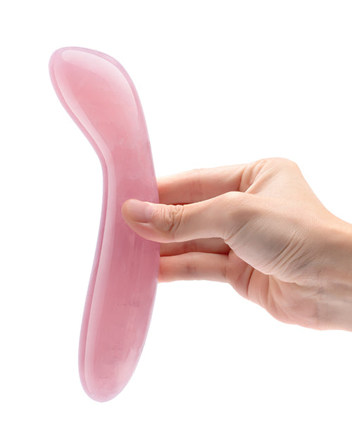 Le Wand Crystal G-Wand Stimulator Rose Quartz held in a hand, showcasing its elegant design.