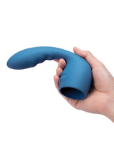 Le Wand Petite Flexi Silicone Attachment Blue held in hand, showcasing its flexible design and ridged texture.