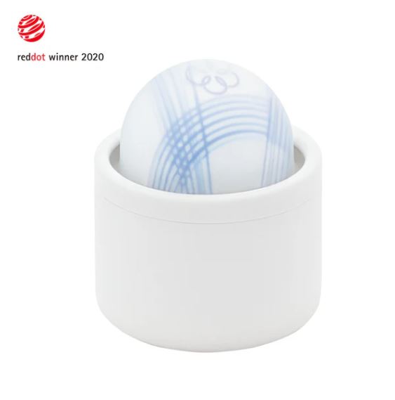 Tenga Iroha Temari Mizu Clitoral Vibrator in its sleek white case, showcasing a unique design and texture.