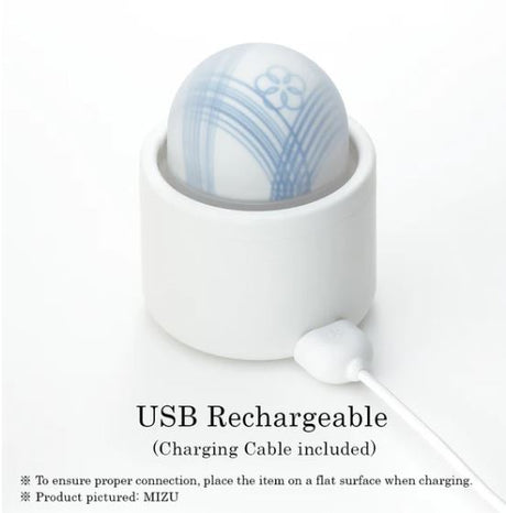 Tenga Iroha Temari Mizu Clitoral Vibrator in USB charging dock with cable