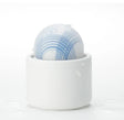 Tenga Iroha Temari Mizu Clitoral Vibrator in a white case with blue design, showcasing its palm-sized design.