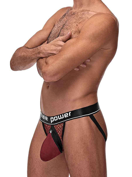 Man wearing Cock Pit Cock Ring Jock Burgundy S/M showcasing bold fishnet design and removable pouch.