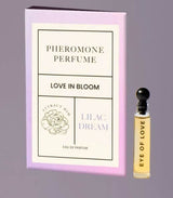 Pheromone perfume box titled 'Love in Bloom' featuring 'Lilac Dream' fragrance and 'Eye of Love' bottle.