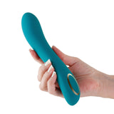 Obsessions Zeus Silicone G-Spot Vibrator Dark Green held in hand, showcasing its sleek design and button features.