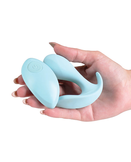 Minnies Pop Panty Vibe with Remote Blue held in a hand, showcasing its flexible design and compact size.
