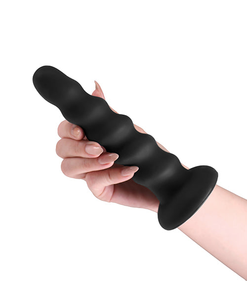 Colours Twist Silicone Dildo 6.5 inches Black held in hand, showcasing its contour design and suction cup base.