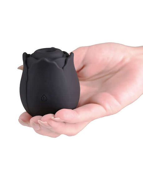 INYA The Vibrating Rose Massager Black held in a hand showcasing its sleek design and discreet shape.