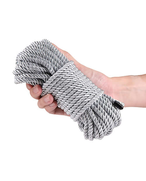 Bound 50 ft Bondage Restraints Rope Silver held in hand, showcasing its comfortable and secure design.