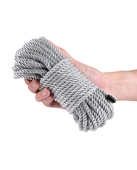 Bound 50 ft Bondage Restraints Rope Silver held in hand, showcasing its comfortable and secure design.