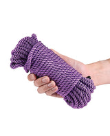 Bound 50 ft Bondage Restraints Rope Purple held in hand.