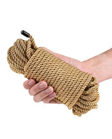 Bound 50 ft Bondage Restraints Rope Gold held in a hand, showcasing its smooth polyester fiber material.