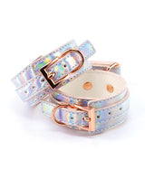 Cosmo Bondage Ankle Cuffs Rainbow with holographic finish and rose gold buckles for stylish restraint in intimate play.