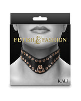 Fetish & Fashion Kali Studded Collar Black packaging with hollow golden studs on a sleek black band.