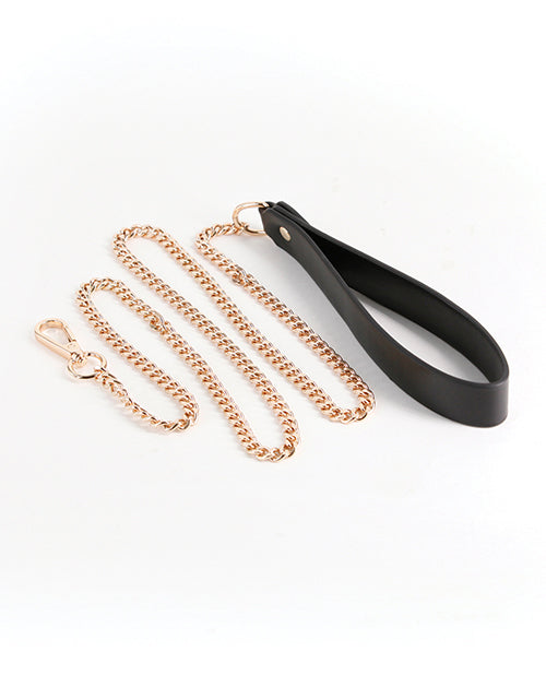 Fetish & Fashion Nyx Leash Black, featuring a black handle and gold chain for bondage play and stylish restraint.