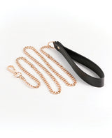 Fetish & Fashion Nyx Leash Black, featuring a black handle and gold chain for bondage play and stylish restraint.
