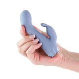 Charms Ivy Blue Silicone Rabbit Vibrator held in a hand showcasing its sleek design and dual-action stimulation features.