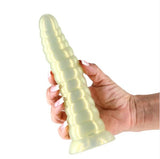 Fantasia Nymph 7.4 Inch Flexible Dildo Amber held in hand, featuring a smooth, shimmering finish.