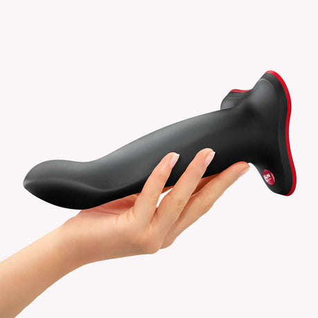Fun Factory Limba Flex L Bendable Dildo Black being held in hand, showcasing its flexible design for personalized pleasure.