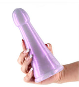A hand holding the Fantasia Phoenix Orchid Flexible TPE Dildo, showcasing its shimmering design and flexible shape.