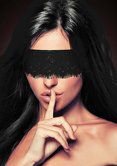Ouch Mystere Lace Eye Mask Blindfold Black displayed on a model expressing mystery and allure.