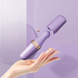 Sweet Secret Massager in purple with dual stimulation features, floating above a hand against a purple background.