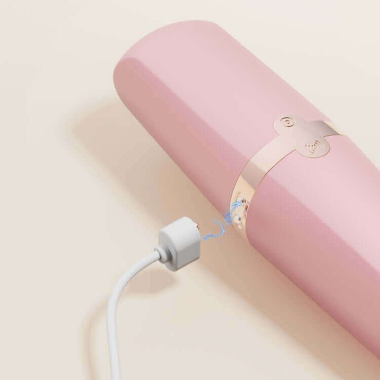 Sweet Secret Massager Pink being charged with magnetic USB cable