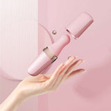 Hand holding the Sweet Secret Massager Pink with cap removed, showcasing its sleek design for dual clitoral suction and wand vibration.