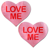 Pastease Love Me Heart Pink Nipple Pasties in playful heart shape with bold 'LOVE ME' text.