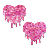 Pastease Pink Melty Heart Disco Ball Nipple Pasties showcase sparkly pink heart shapes with a melting design.