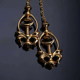 Elegant gold pulling chain nipple clamps with intricate design, showcasing adjustable pain control and comfortable fit.
