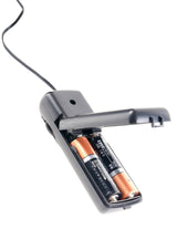 Battery compartment of a black device showing two AA batteries inserted.