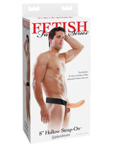 Fetish Fantasy 8 inch Hollow Strap On Flesh packaging featuring model wearing a strap-on with adjustable elastic harness.