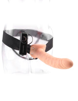 Fetish Fantasy 8 Inch Vibrating Hollow Strap On Flesh with adjustable harness on a mannequin.