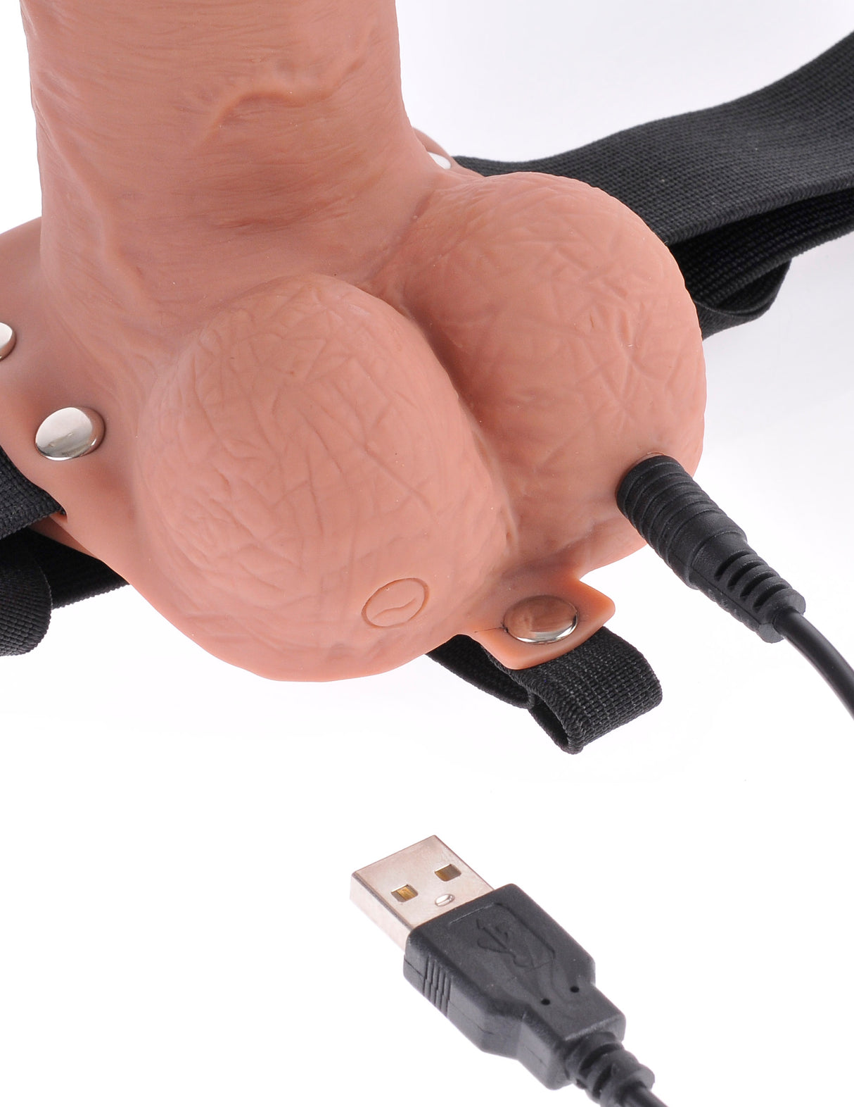 Fetish Fantasy 7 Inch Hollow Strap-On Remote Tan close-up with USB connection and elastic harness.
