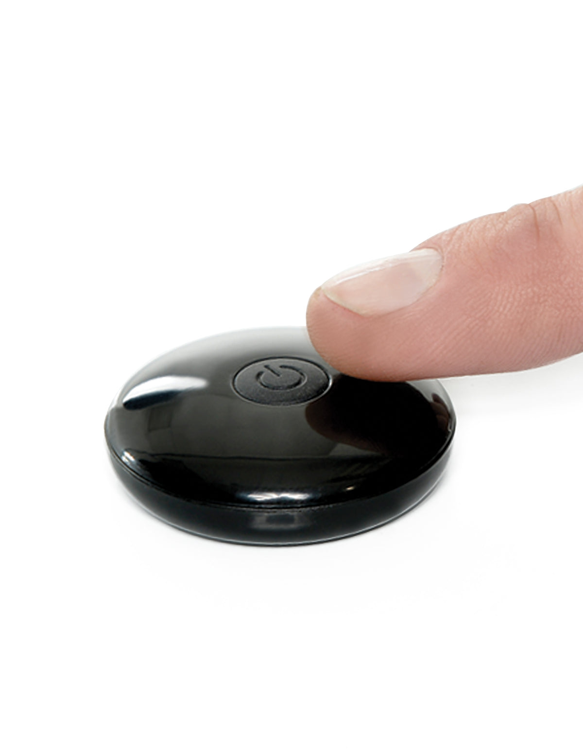 Fetish Fantasy 7 Inch Hollow Strap-On Remote Tan remote control being pressed.