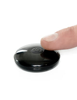 Fetish Fantasy 7 Inch Hollow Strap-On Remote Tan remote control being pressed.