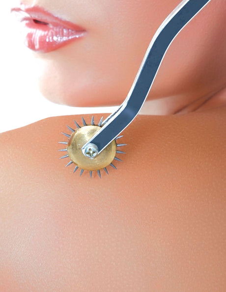 Fetish Fantasy Deluxe Wartenberg Wheel Black and Silver in use on skin for heightened sensation and teasing.