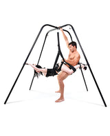 Fetish Fantasy Series Swing Stand Black being used for adult play with a couple in a bondage setting.