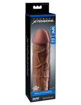 Fantasy X-Tensions Mega 2 Inch Penis Extension Brown packaging showcasing the erection enhancer for added length and girth.