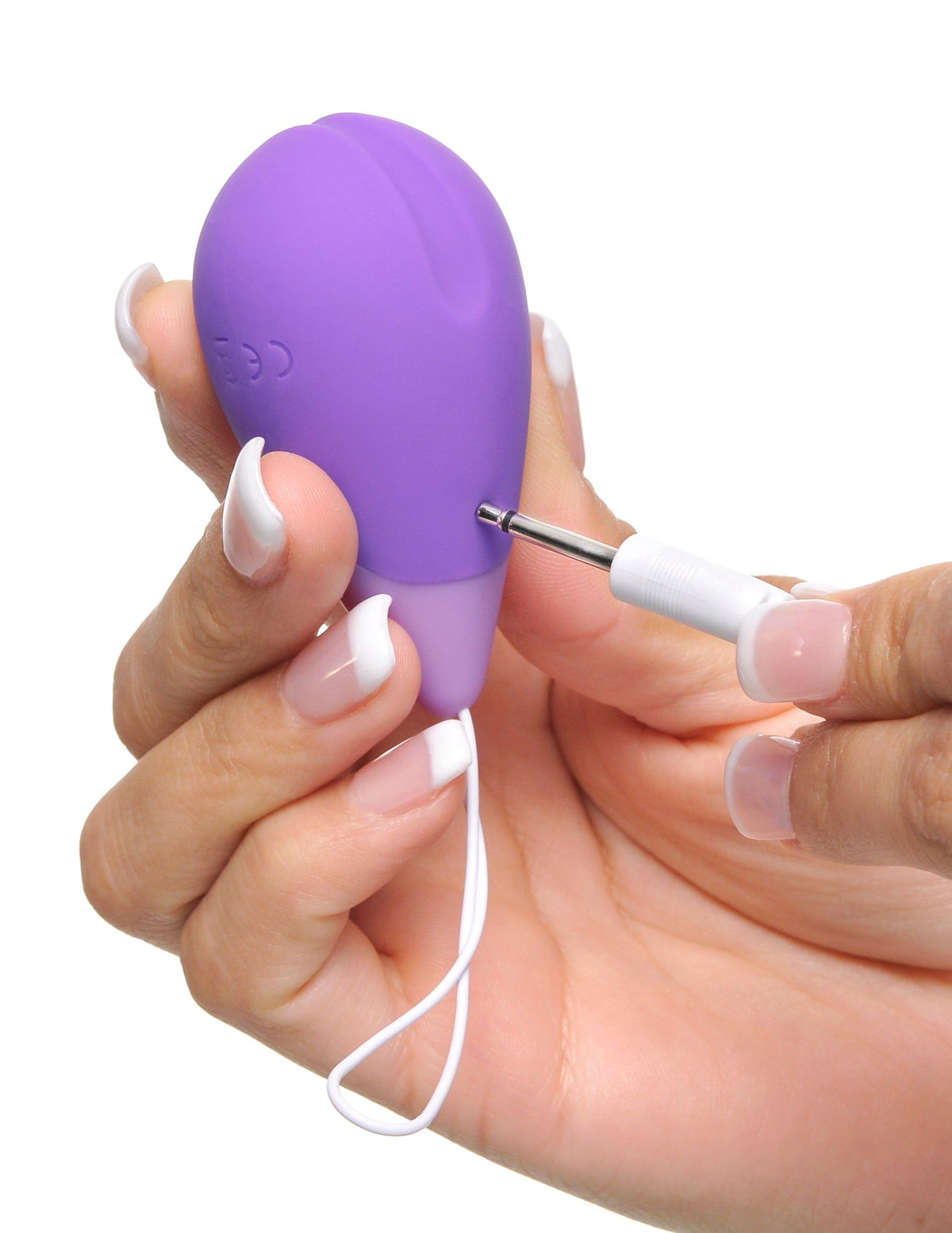 Fantasy For Her Remote Kegel Excite-Her Purple being held, showcasing its sleek design and remote feature.
