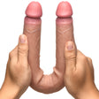 Jock 15.75 Inch Double Ended Dildo Silicone Medium held by hands, showcasing its dual shafts and realistic design.