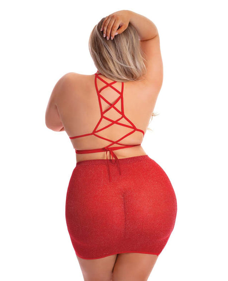 Back view of a model wearing the Pink Lipstick Midnight Sun Skirt Set Red Queen, showcasing its strappy design and fitted skirt.