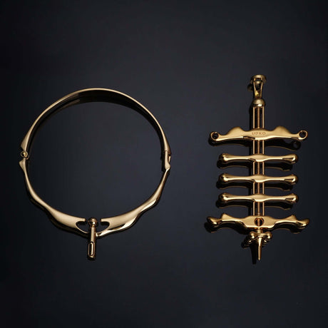 UPKO Migratory Bird metal collar and fingers clamps set in luxurious gold, showcasing elegant design and craftsmanship.