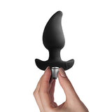 Rocks Off Butt Quiver Black Vibrating Butt Plug held in hand, showcasing its sleek design and removable bullet for pleasure.