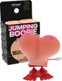 Hott Products Jumping Boobie Wind Up Party Toy jumping across a flat surface with playful packaging.
