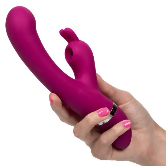 Foreplay Bunny Kisser Rabbit Vibrator Purple held in hand, showcasing its dual-action design for pleasure.