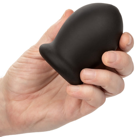 Person holding the Boundless Rechargeable Vibrating Stroker in hand, showcasing its ergonomic design.