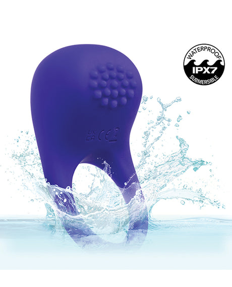 Rumbler Rumble Vibrating Ring Purple submerged in water, showcasing its waterproof design and textured nubs for enhanced sensation.