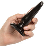 Colt Anal Trainer Kit Butt Plugs held in hand, showcasing the tapered design and texture for beginners.